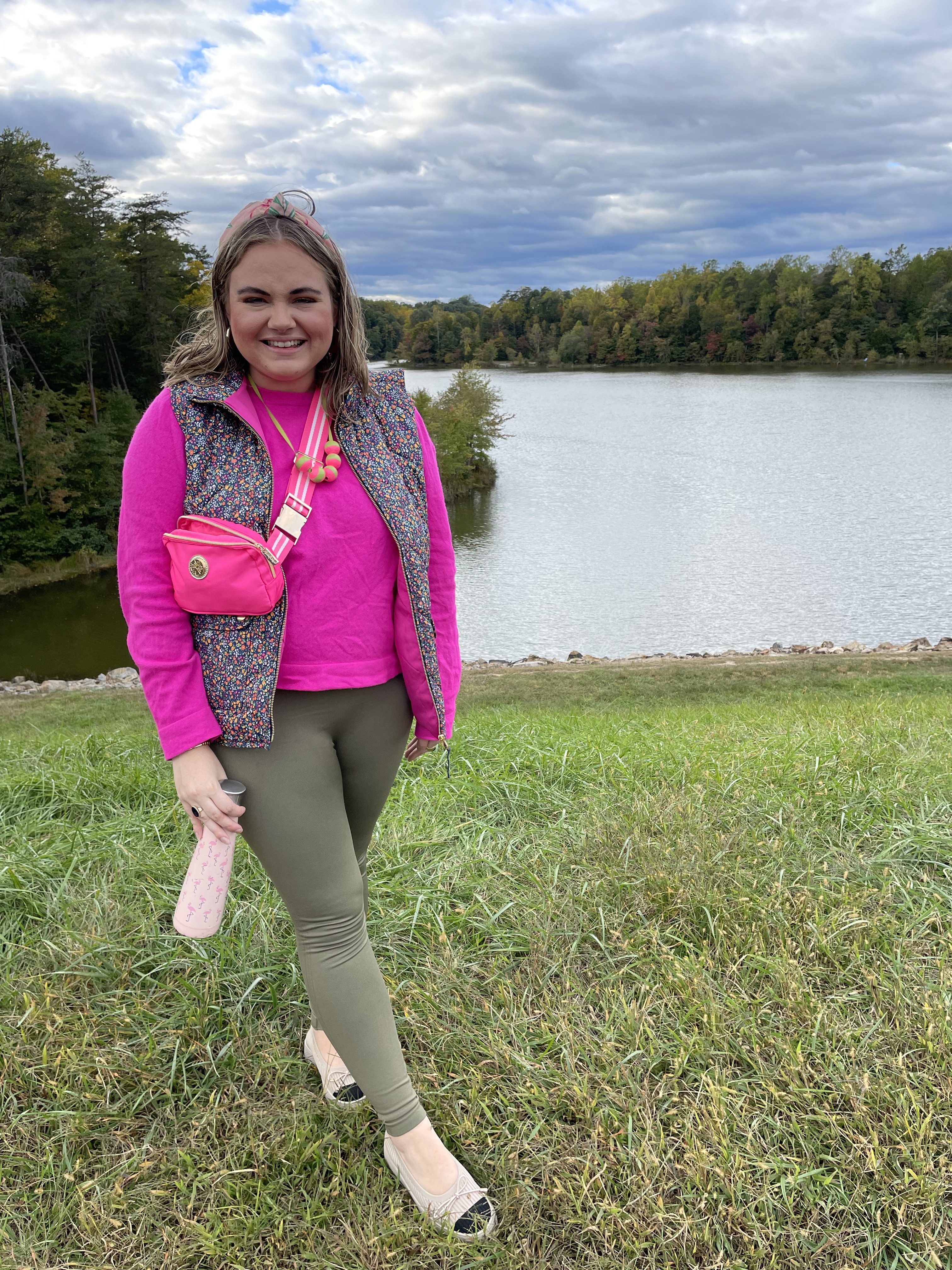 Fall Preppy Outfits hot pink long-sleeved shirt paired with a dark-patterned quilted puffer vest