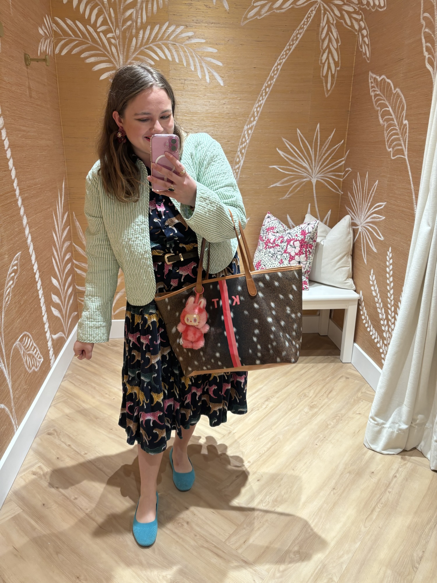 Fall Preppy Outfits Fall preppy outfit featuring a colorful patterned midi dress paired with a mint green textured knit sweater jacket, bright turquoise blue flats, and a monogram tote bag