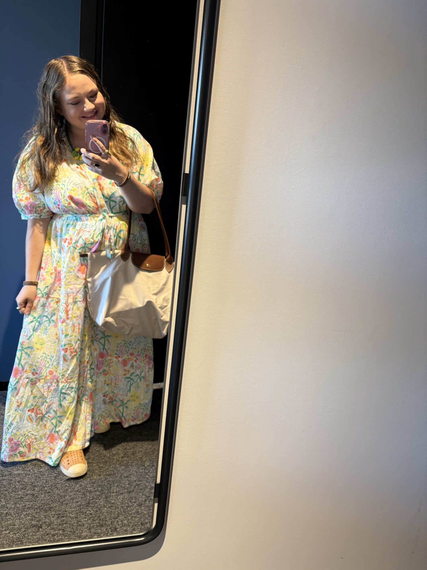 Pink Chickadee wearing a preppy outfit: colorful floral-print tiered maxi dress with short puff sleeves
