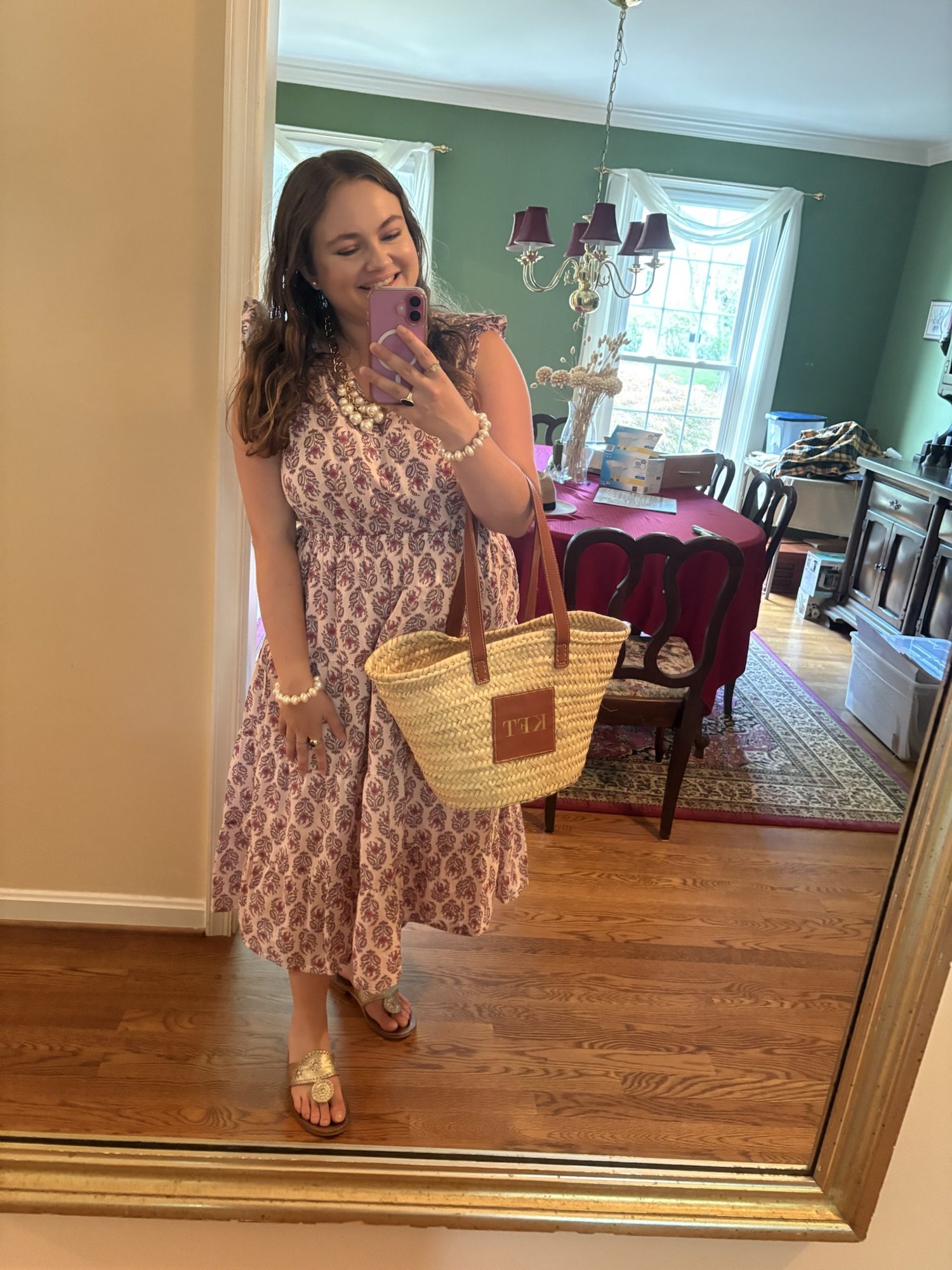 preppy summer outfit featuring a smocked pink and burgundy floral midi dress